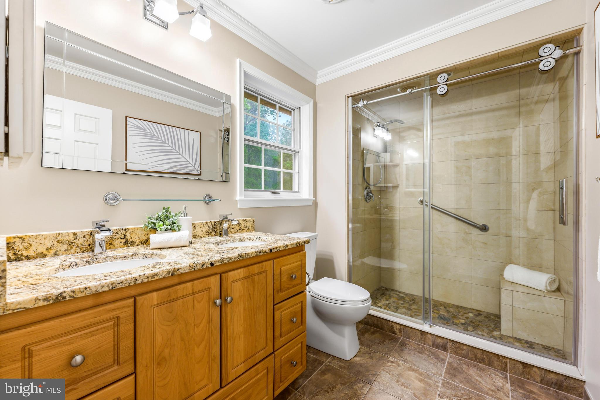 1074 Foxcroft Run Annapolis, MD 21401 - Photo 31 of 66 a bathroom with a granite countertop sink toilet and shower