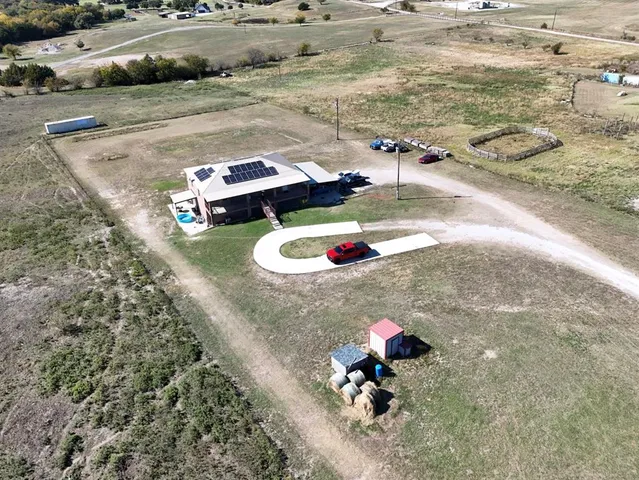 a small pool with some trees in the background