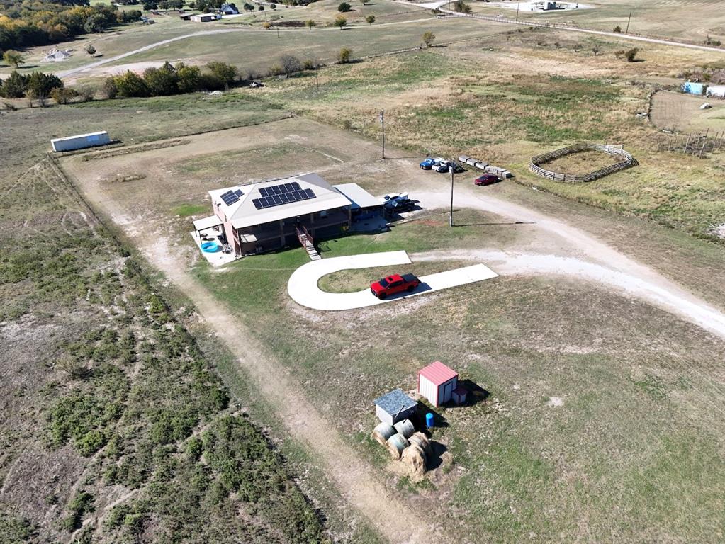 528 County Road 4227 Decatur, TX 76234 - Photo 2 of 22 a small pool with some trees in the background