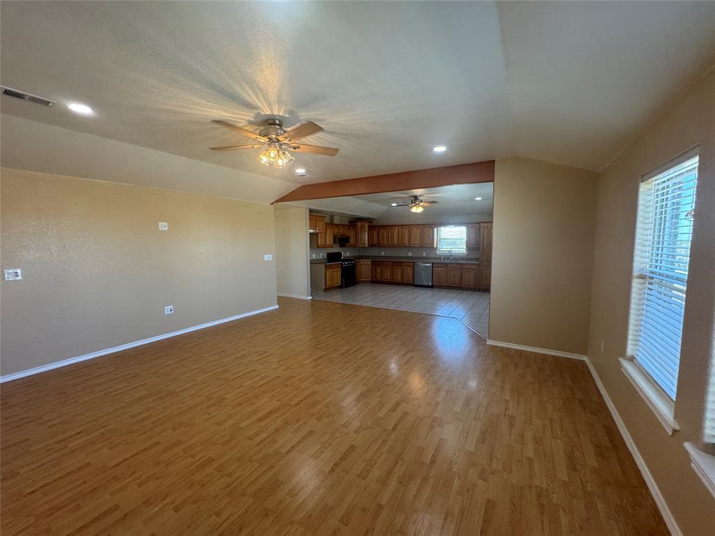 528 County Road 4227 Decatur, TX 76234 - Photo 6 of 22 wooden floor in an empty room with a window