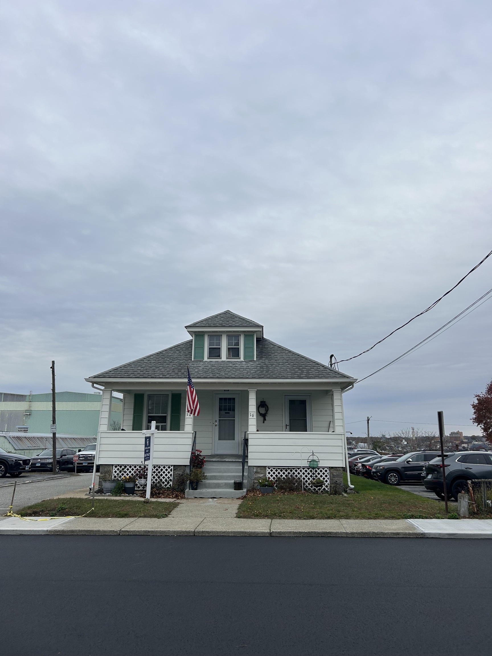 a front view of a house with a yard table and chairs