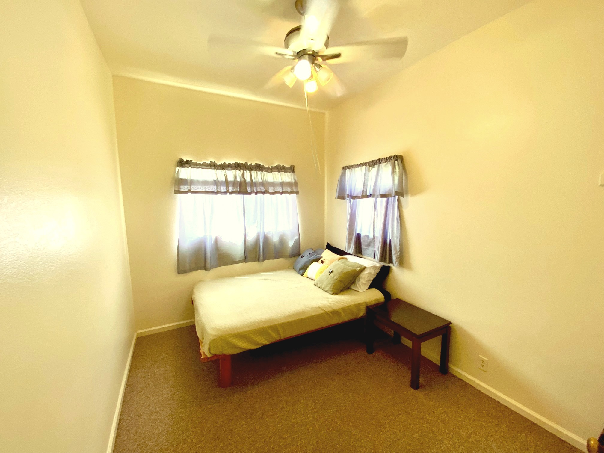 43-971 Namilimili Lane Paauilo, HI 96776 - Photo 9 of 13 a bedroom with a bed and table