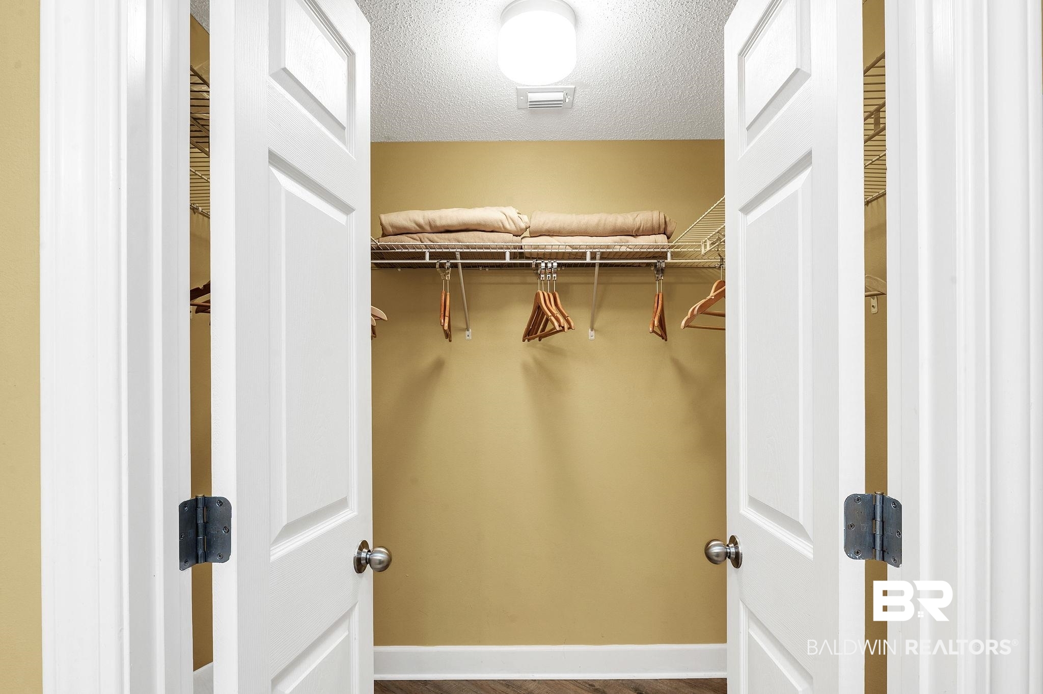 27580 Canal Road, Unit 1214 AND BOAT SLIP #62 Orange Beach, AL 36561 - Photo 29 of 67 Walk in closet with wood finished floors and visible vents