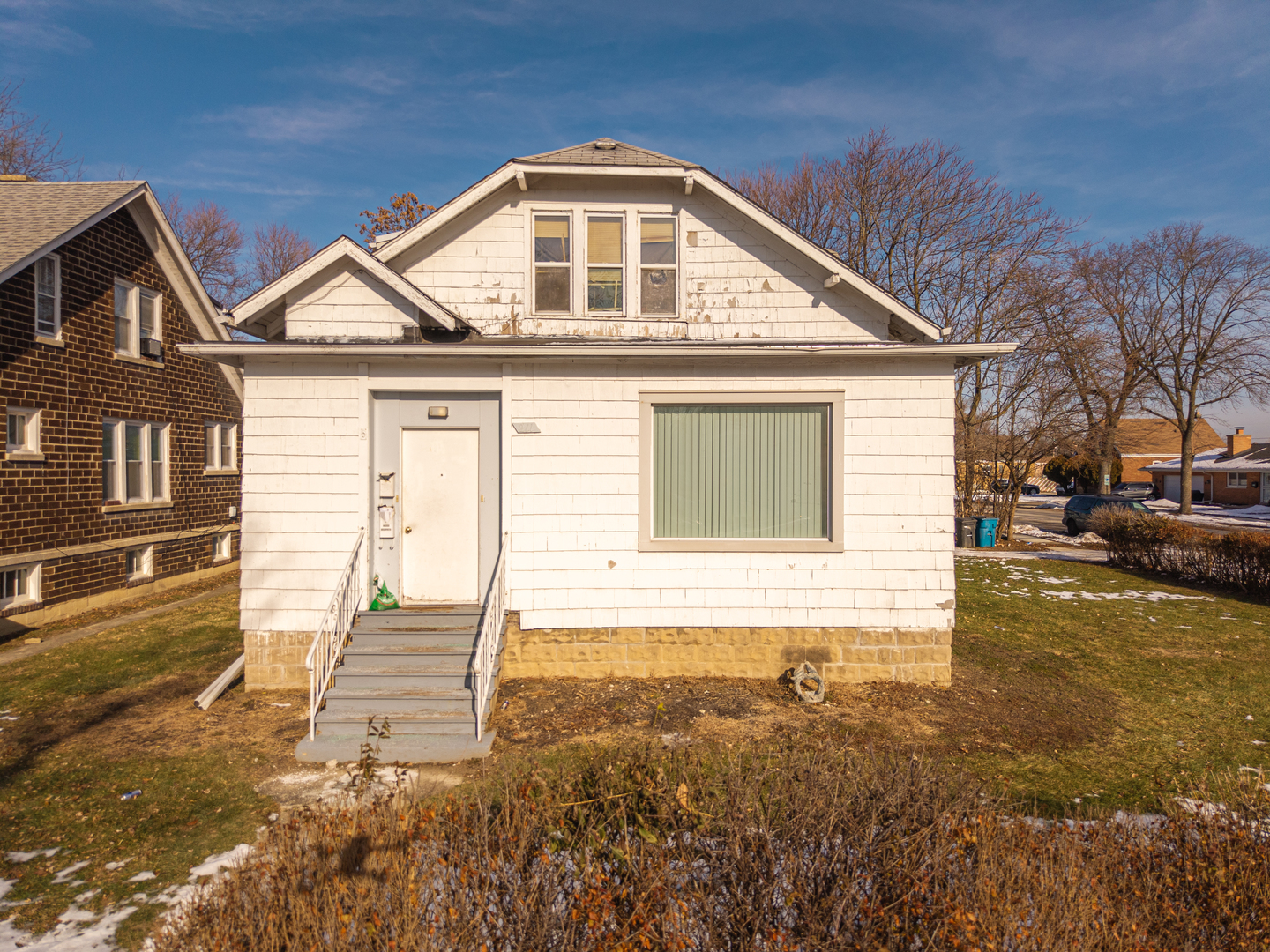 211 7th Place Chicago Heights, IL 60411 - Photo 2 of 10 a front view of a house with a yard