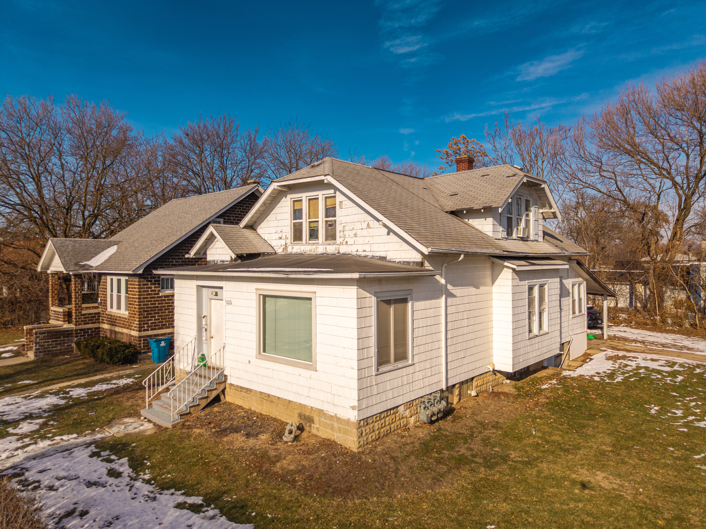 211 7th Place Chicago Heights, IL 60411 - Photo 3 of 10 a front view of a house with a yard