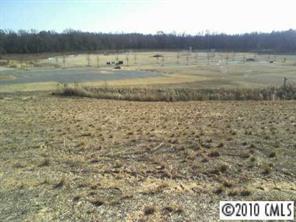 1737 Ridgehaven Road Waxhaw, NC 28173 - Photo 6 of 8 a view of a lake with a mountain in the background