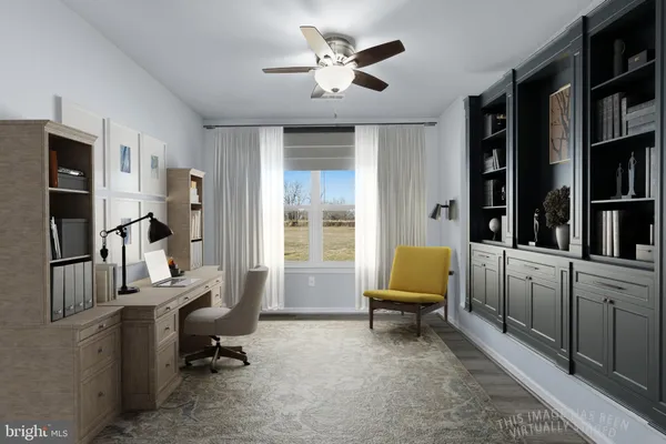 a living room with furniture and a piano