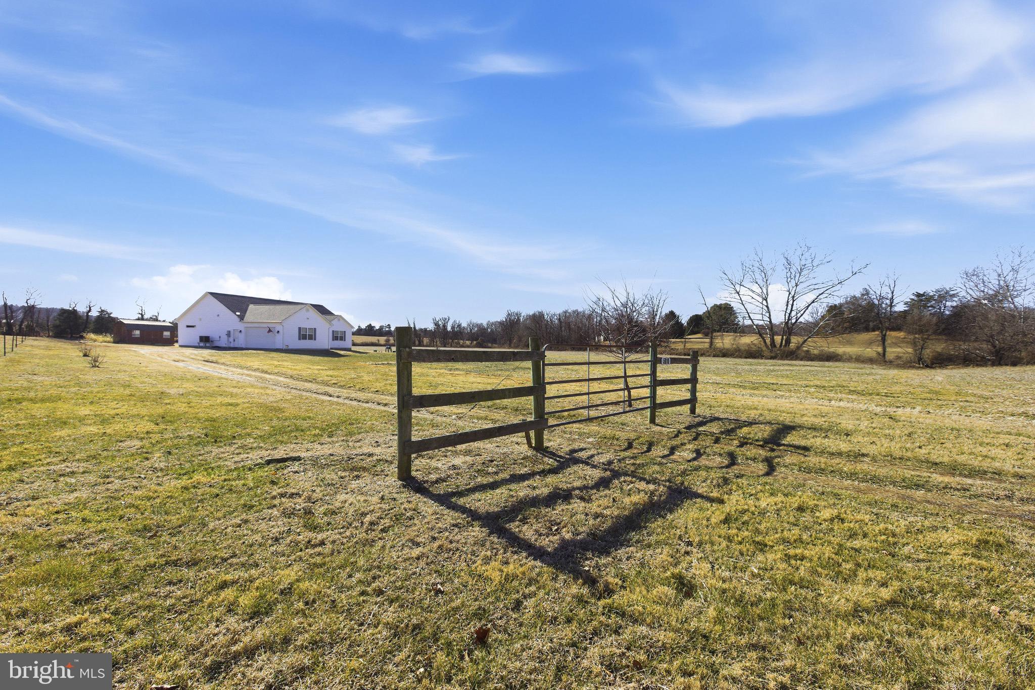 5810 West Hoover Road Reva, VA 22735 - Photo 2 of 25 a view of a lake with houses in the back