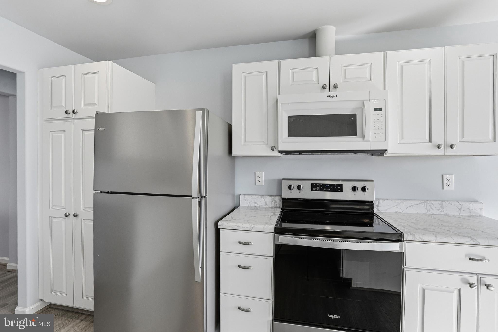 5810 West Hoover Road Reva, VA 22735 - Photo 9 of 25 a white refrigerator freezer and a stove top oven