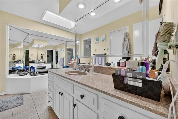 a kitchen with sink and cabinets