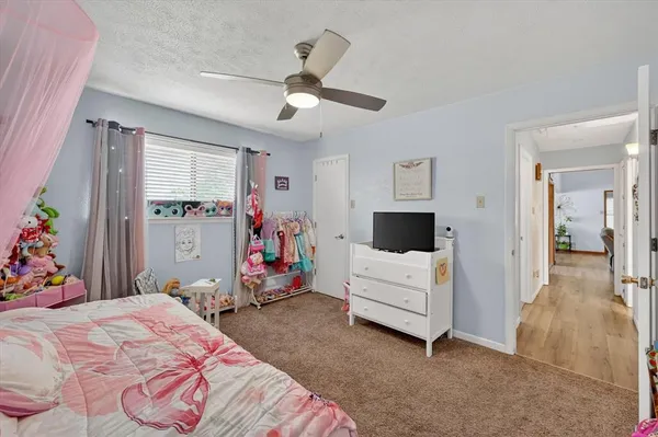 a room with furniture and a flat screen tv