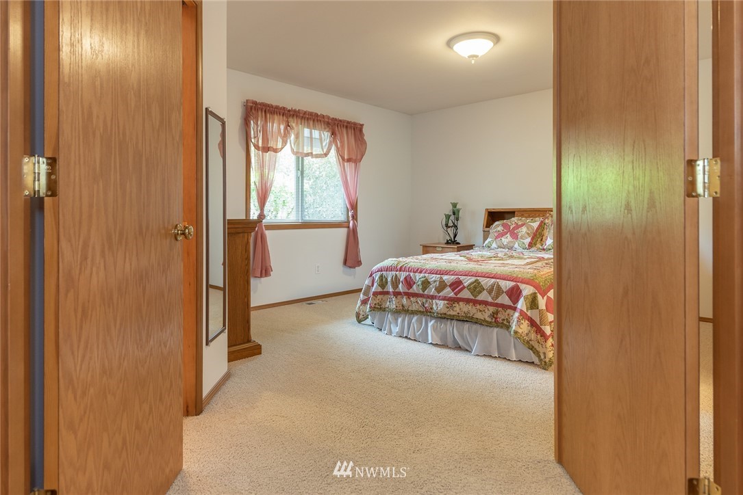 5203 53rd Street West University Place, WA 98467 - Photo 13 of 35 a bedroom with a bed and a window