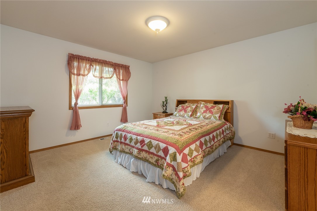 5203 53rd Street West University Place, WA 98467 - Photo 14 of 35 a bedroom with a bed and window
