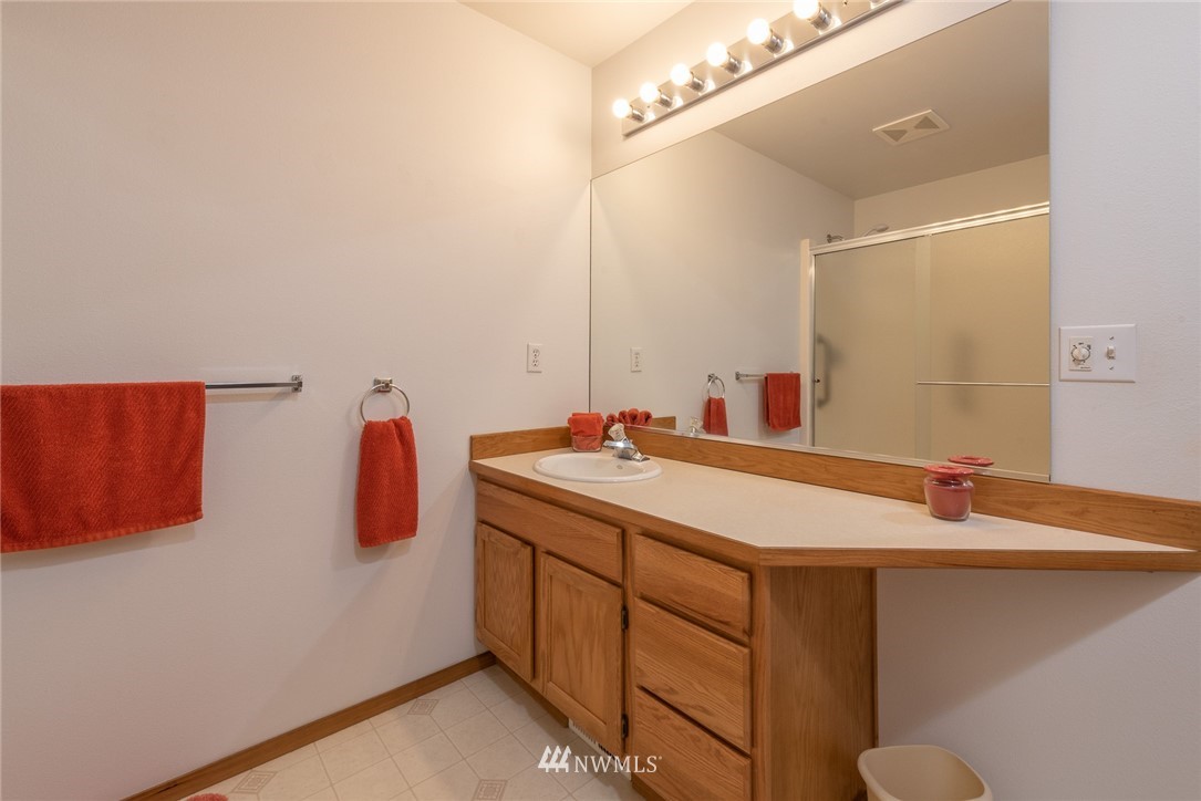 5203 53rd Street West University Place, WA 98467 - Photo 19 of 35 a bathroom with a sink and a mirror