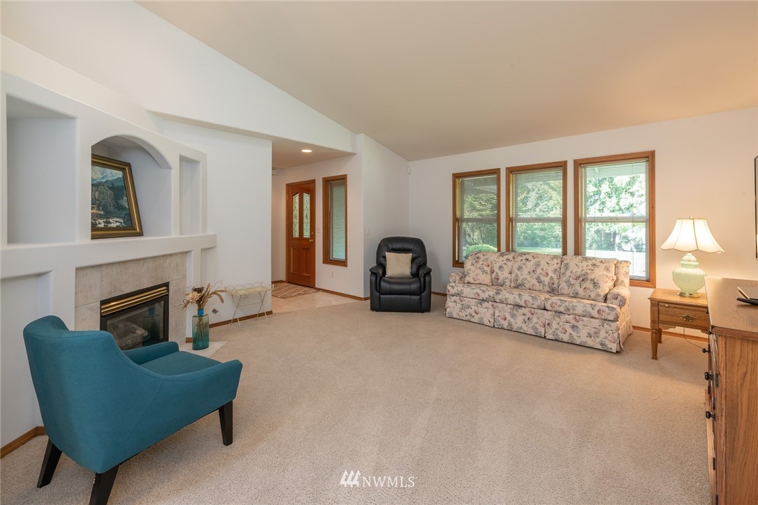 5203 53rd Street West University Place, WA 98467 - Photo 3 of 35 a living room with furniture and a fireplace