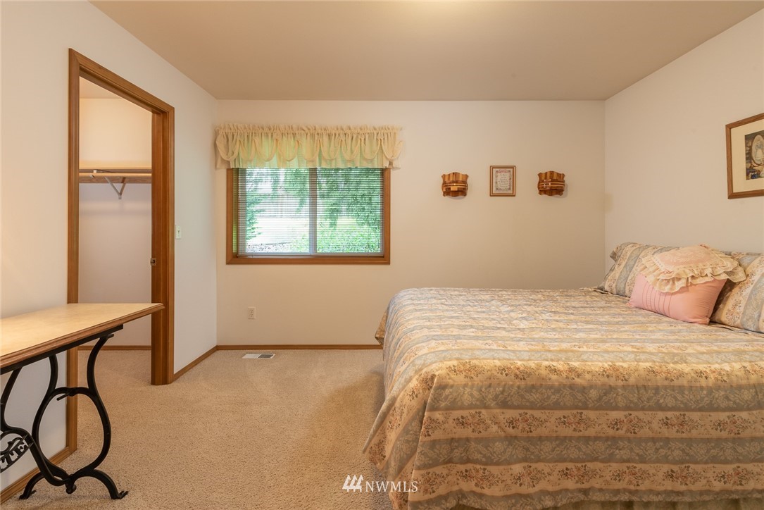 5203 53rd Street West University Place, WA 98467 - Photo 22 of 35 a bedroom with a bed and with windows