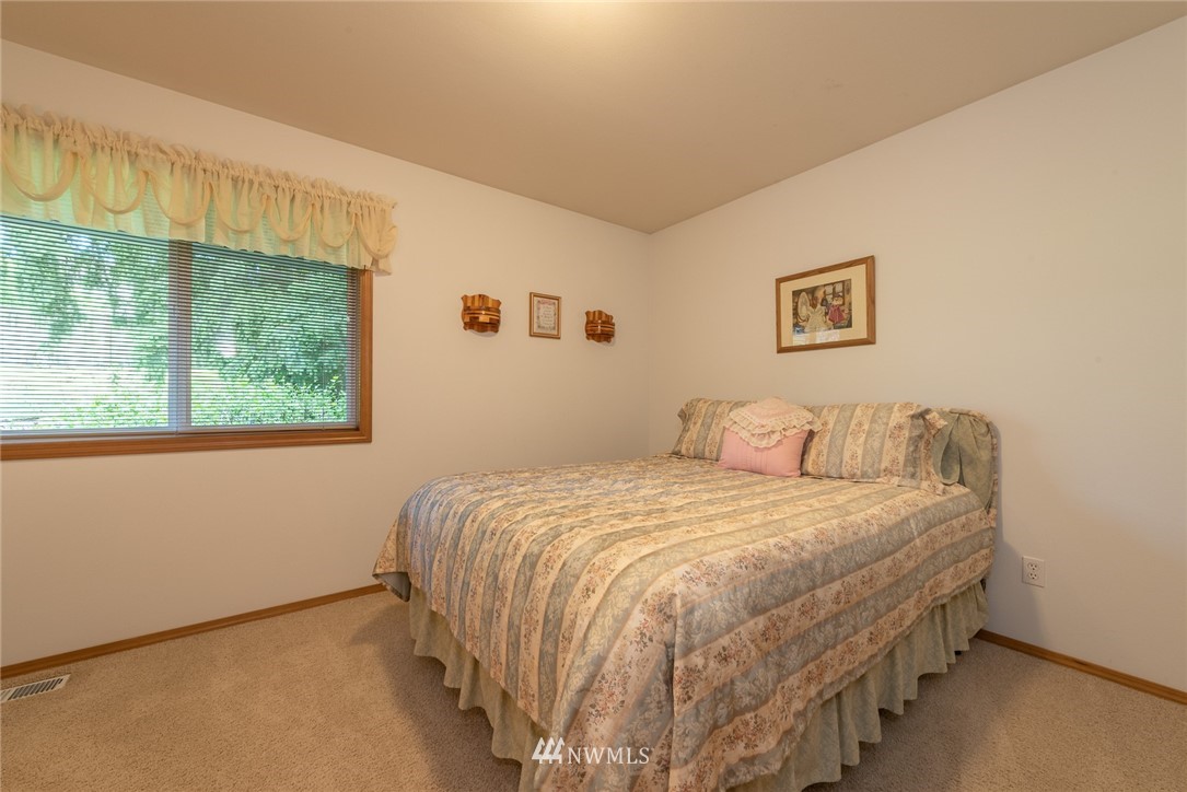5203 53rd Street West University Place, WA 98467 - Photo 23 of 35 a bedroom with a bed and a window