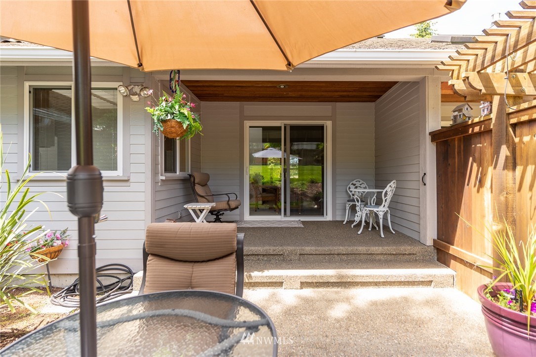 5203 53rd Street West University Place, WA 98467 - Photo 32 of 35 a view of a patio with table and chairs and potted plants