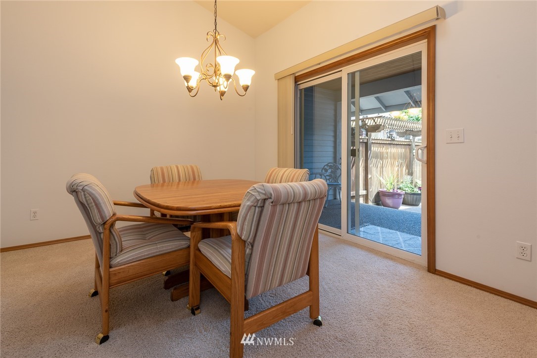 5203 53rd Street West University Place, WA 98467 - Photo 7 of 35 a view of a dining room with furniture and chandelier