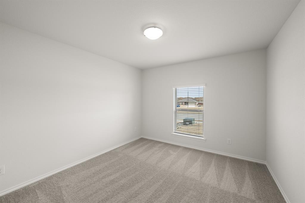 1184 Oak Spring Drive Burleson, TX 76028 - Photo 15 of 27 a view of an empty room with a window