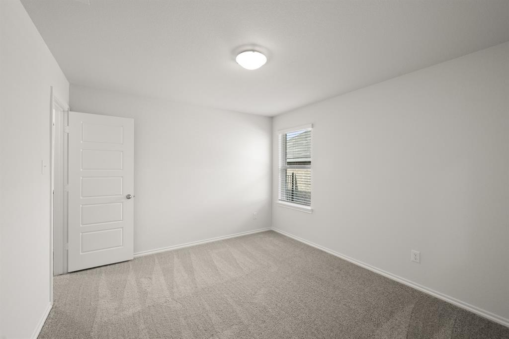 1184 Oak Spring Drive Burleson, TX 76028 - Photo 16 of 27 a view of an empty room with a window