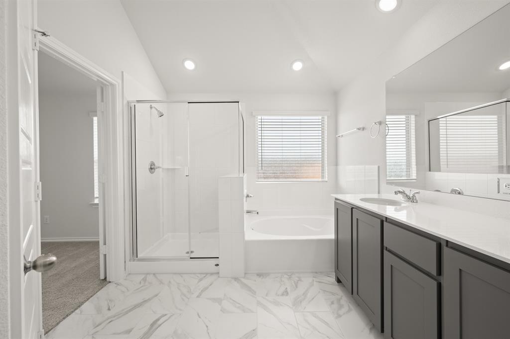 1184 Oak Spring Drive Burleson, TX 76028 - Photo 21 of 27 a bathroom with a tub sink shower and a mirror
