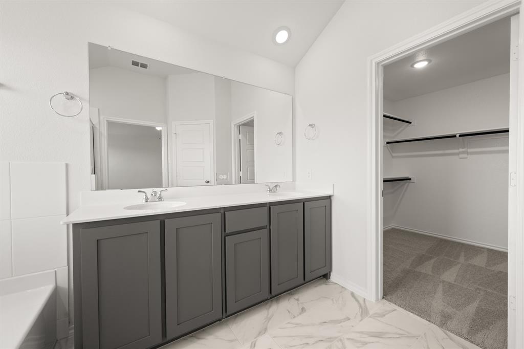 1184 Oak Spring Drive Burleson, TX 76028 - Photo 23 of 27 a bathroom with a double vanity sink and a mirror