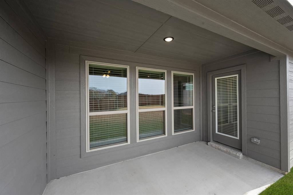1184 Oak Spring Drive Burleson, TX 76028 - Photo 25 of 27 a view of front door of a house