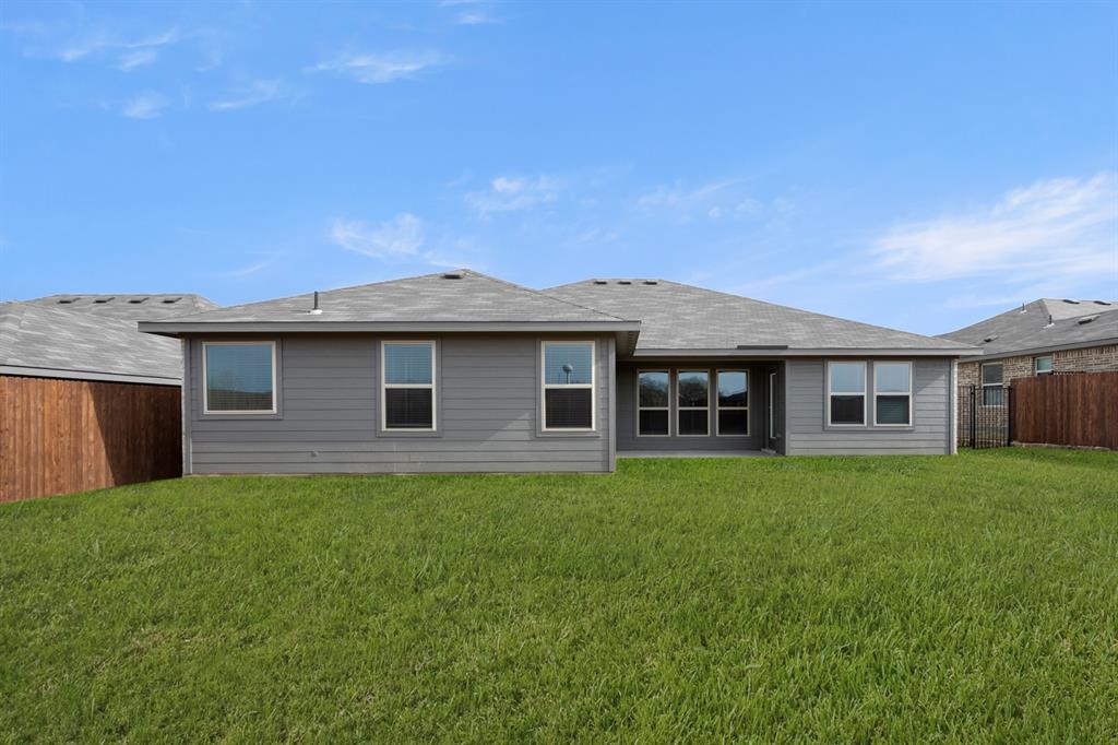 1184 Oak Spring Drive Burleson, TX 76028 - Photo 27 of 27 a view of a yard in front of a house with large trees