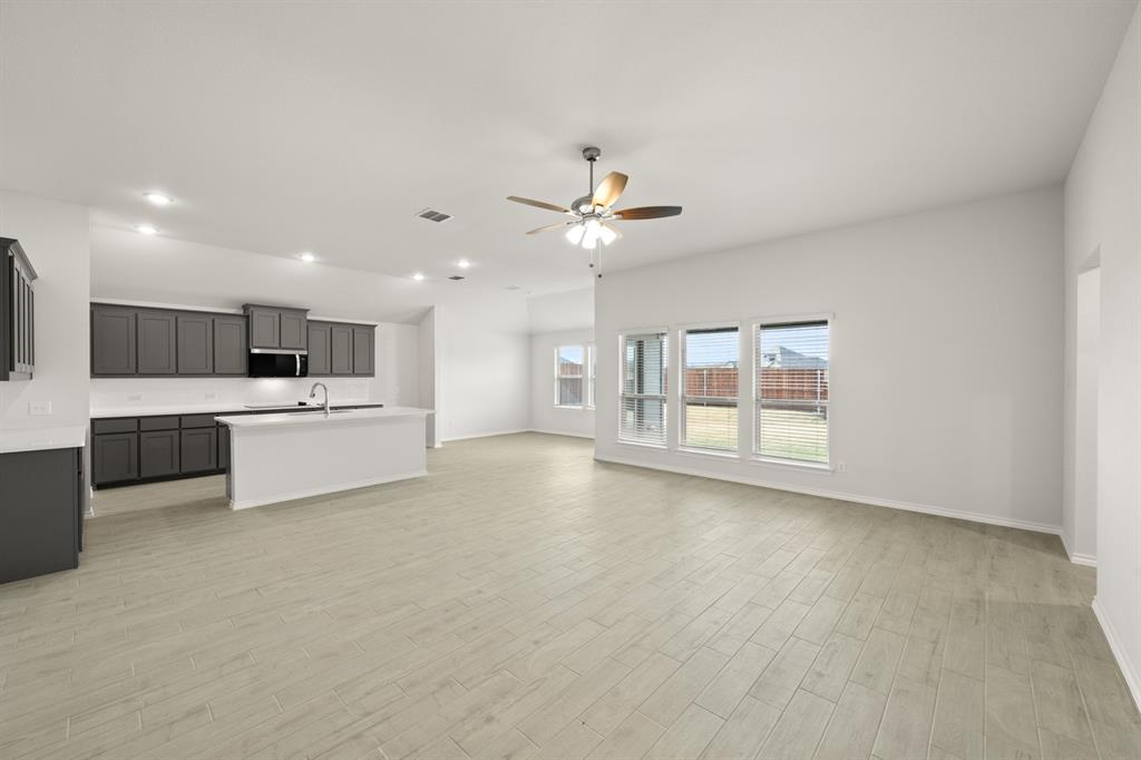 1184 Oak Spring Drive Burleson, TX 76028 - Photo 10 of 27 a view of a kitchen with a sink cabinets and window