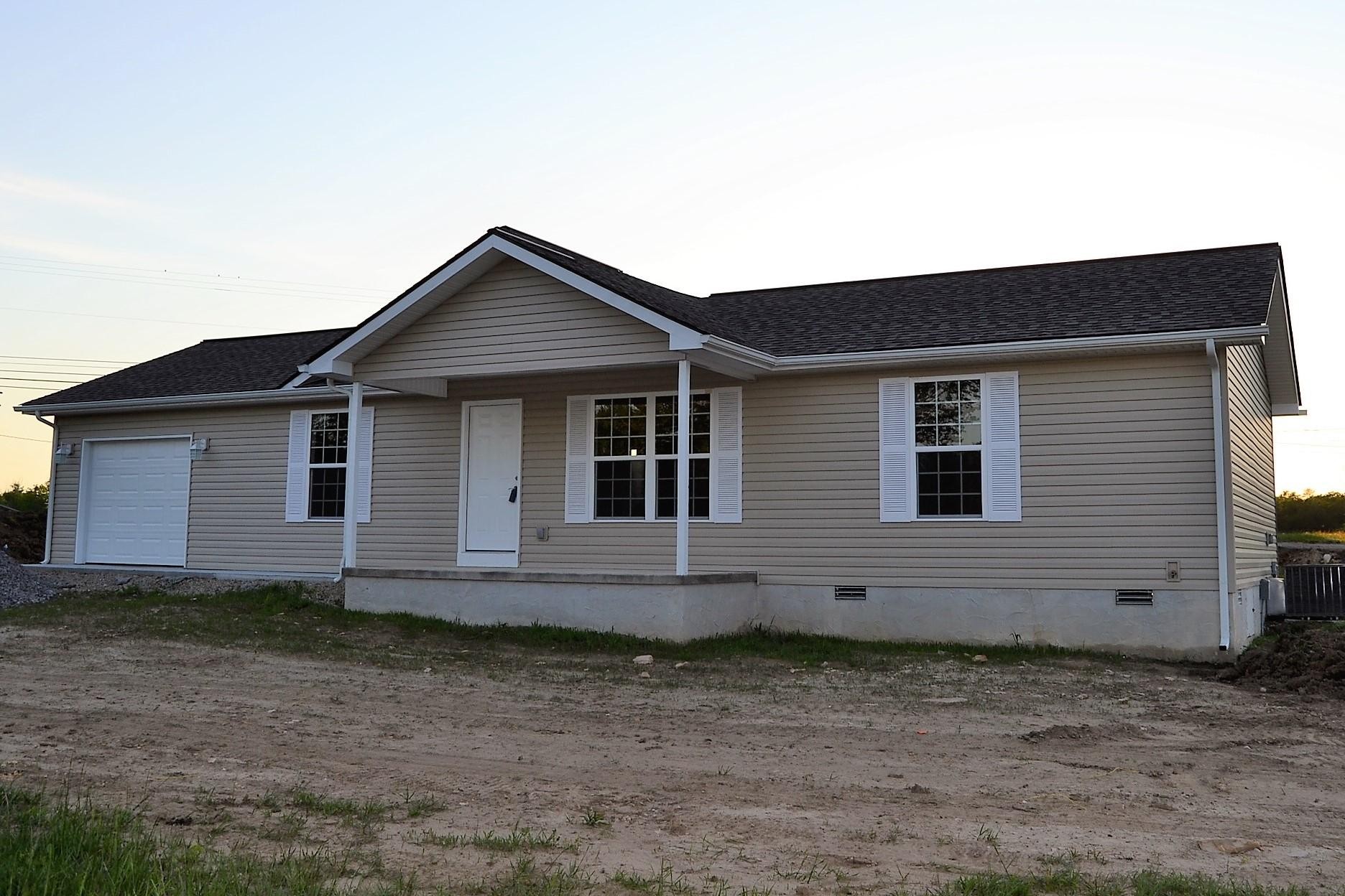 41 York Road Crossville, TN 38555 - Photo 1 of 17 a view of house with wooden fence