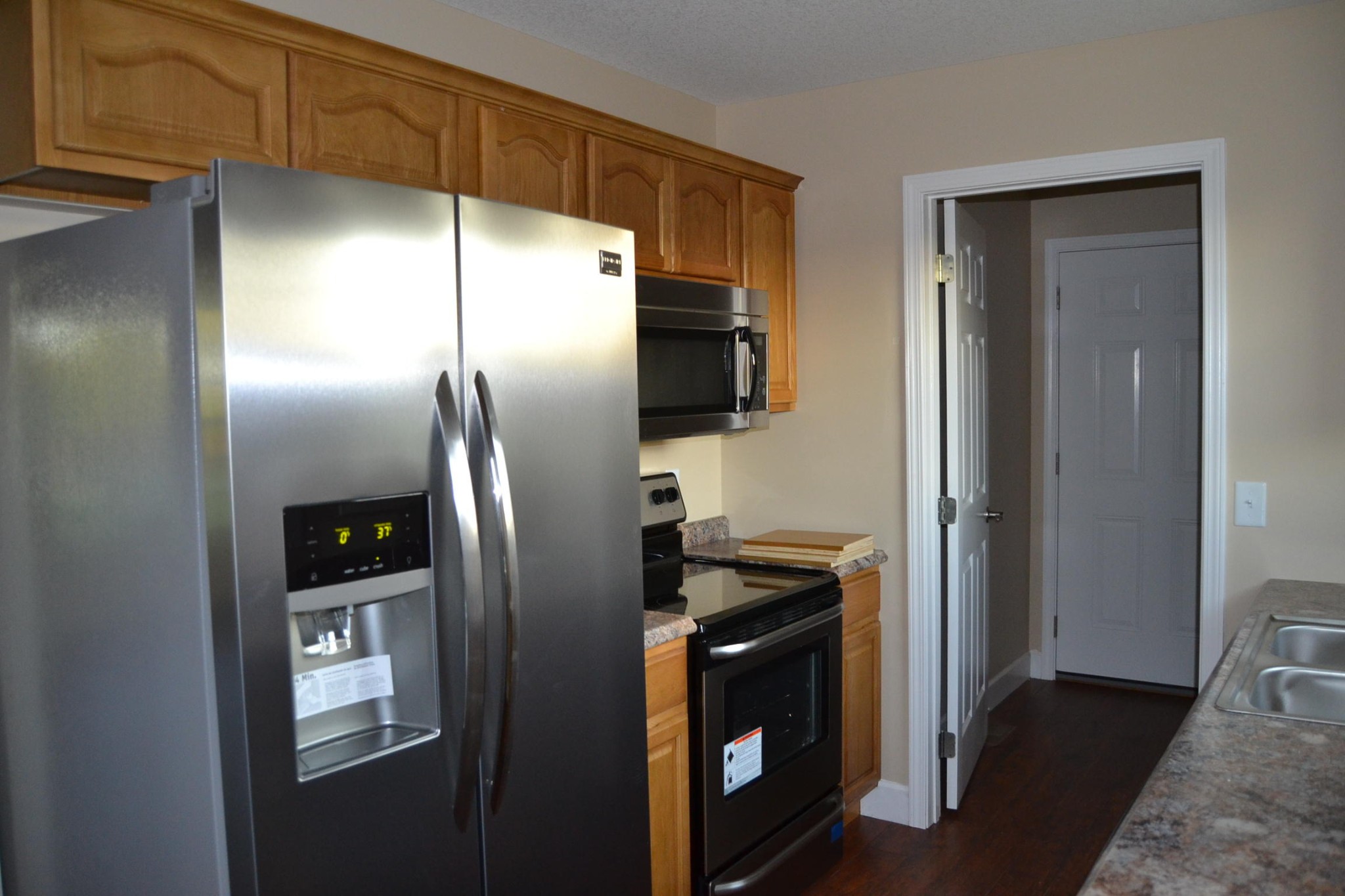 41 York Road Crossville, TN 38555 - Photo 5 of 17 a close view of a refrigerator in kitchen and stainless steel appliances wooden cabinet