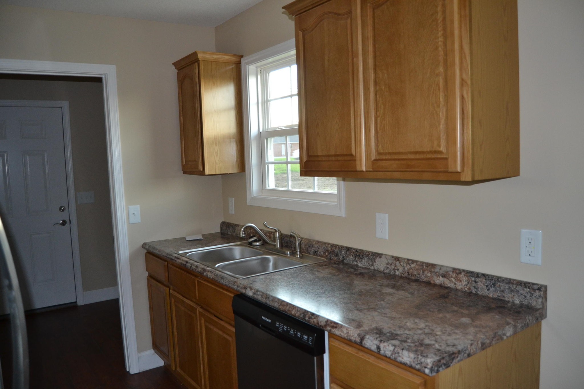 41 York Road Crossville, TN 38555 - Photo 6 of 17 a kitchen with granite countertop a sink a window and cabinets