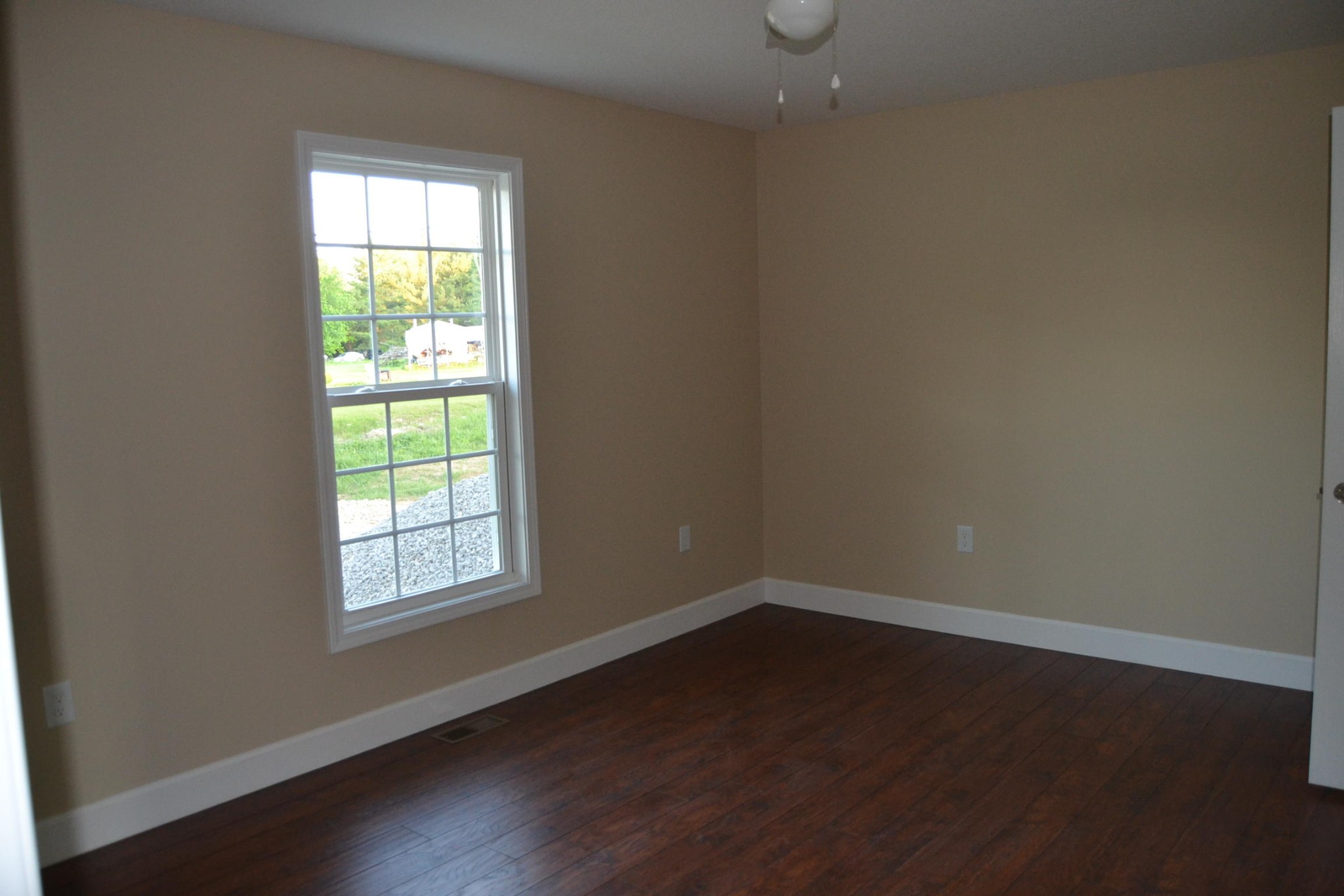 41 York Road Crossville, TN 38555 - Photo 9 of 17 an empty room with wooden floor and windows