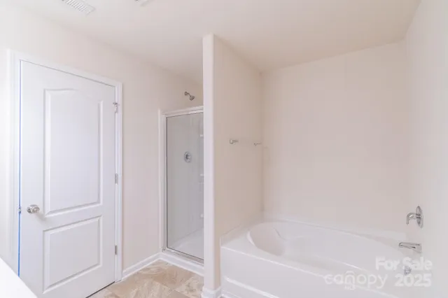 a white bath tub sitting in a bathroom