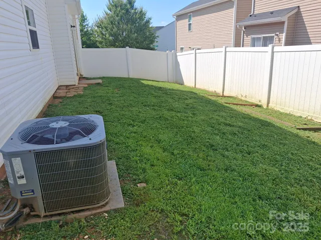 a view of a backyard with a garage