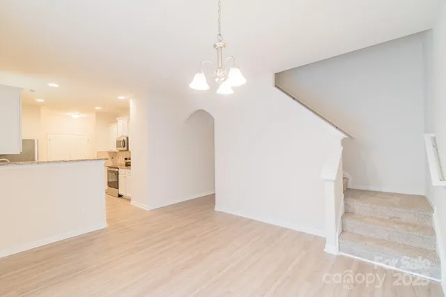 a view of a kitchen with a sink and a living room