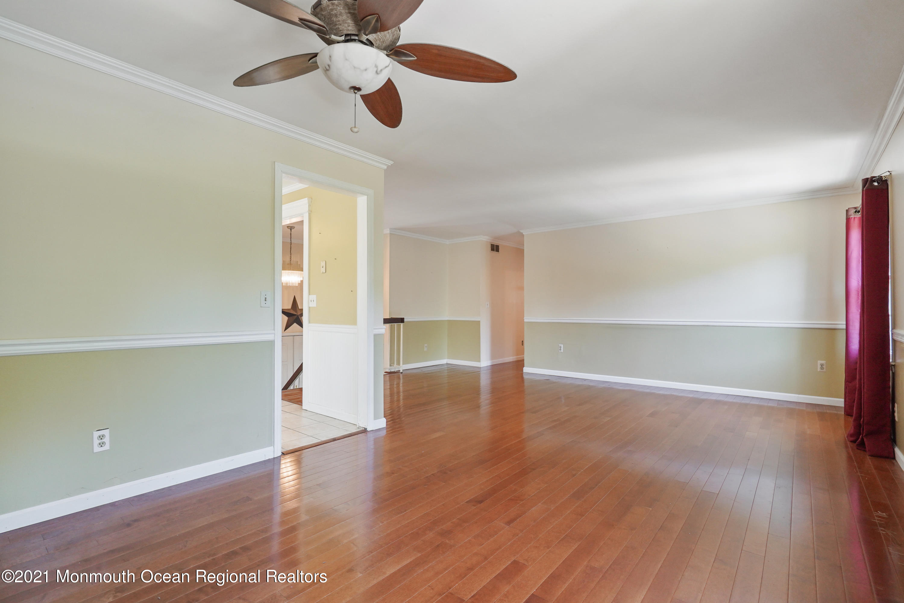 52 Danbury Road Tinton Falls, NJ 07753 - Photo 11 of 50 a view of an empty room with wooden floor ceiling fan