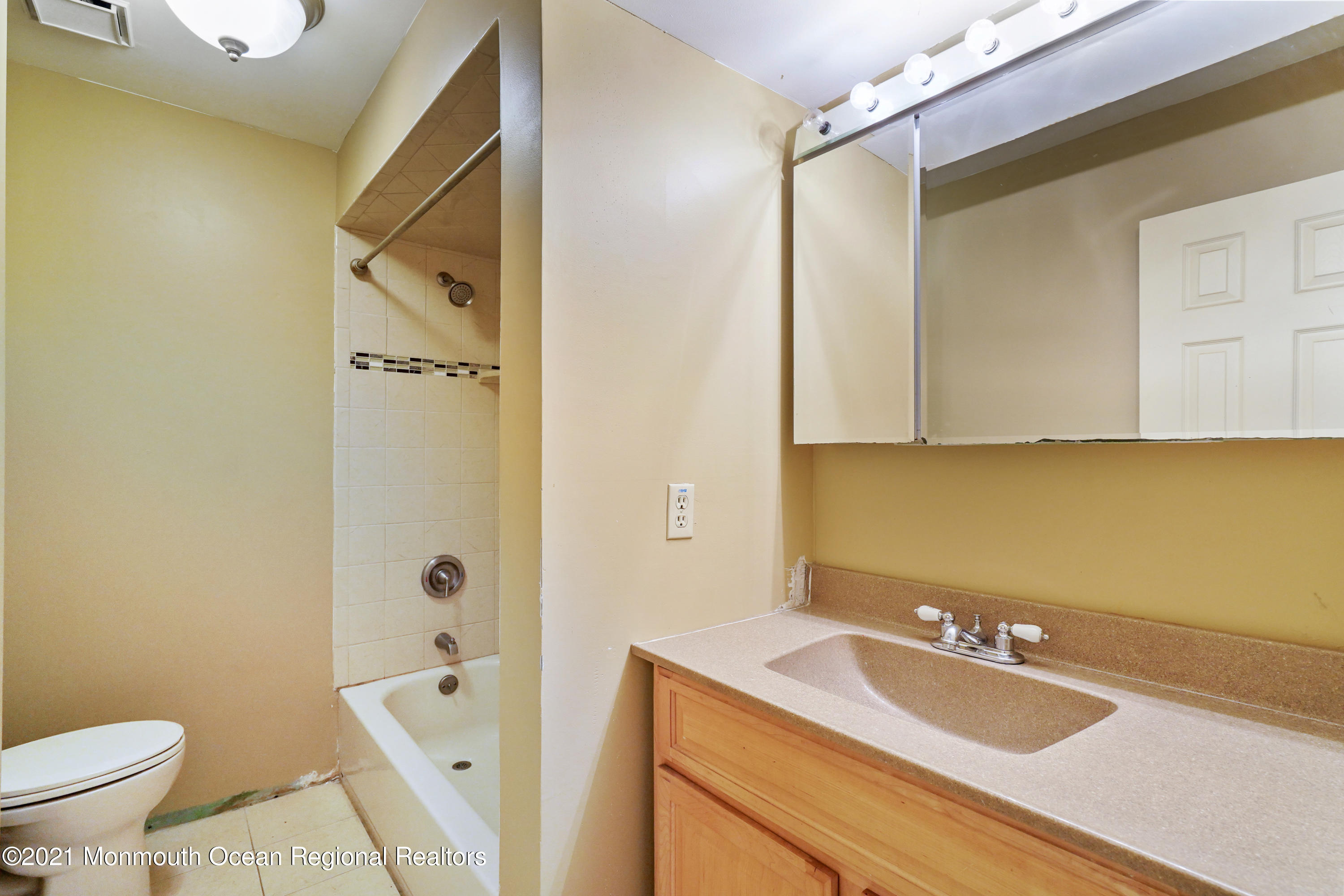 52 Danbury Road Tinton Falls, NJ 07753 - Photo 12 of 50 a bathroom with a sink a toilet and shower