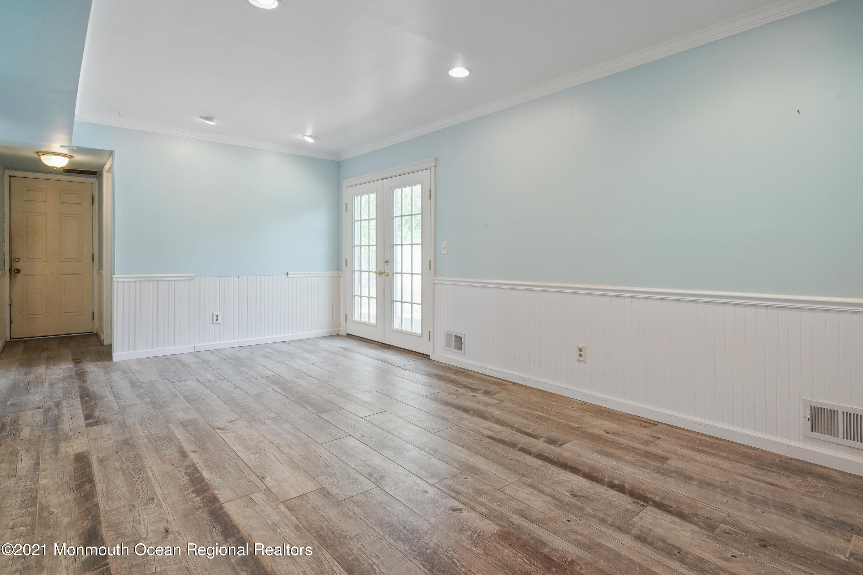 52 Danbury Road Tinton Falls, NJ 07753 - Photo 16 of 50 an empty room with wooden floor and windows