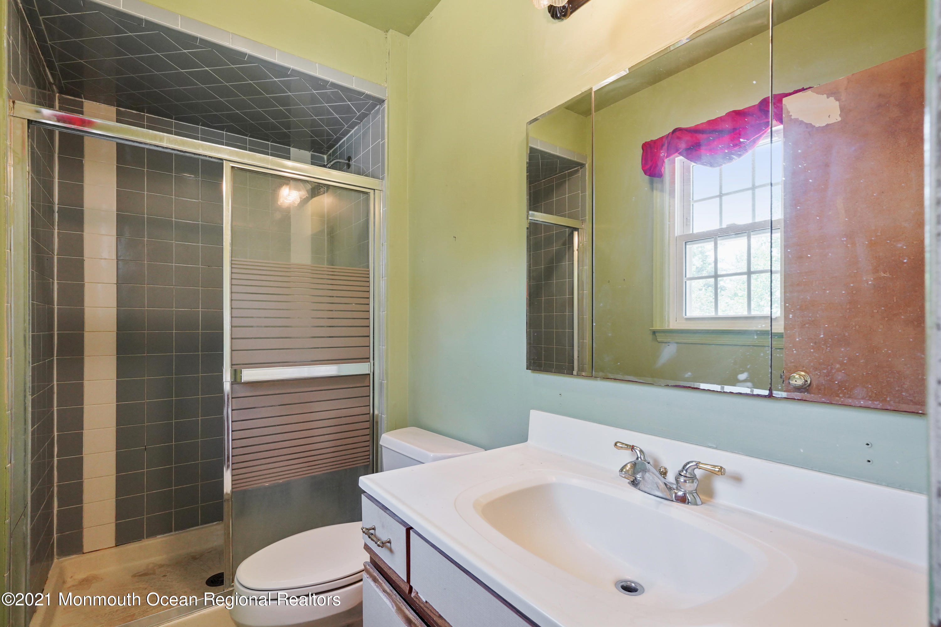 52 Danbury Road Tinton Falls, NJ 07753 - Photo 21 of 50 a bathroom with a sink mirror vanity and toilet