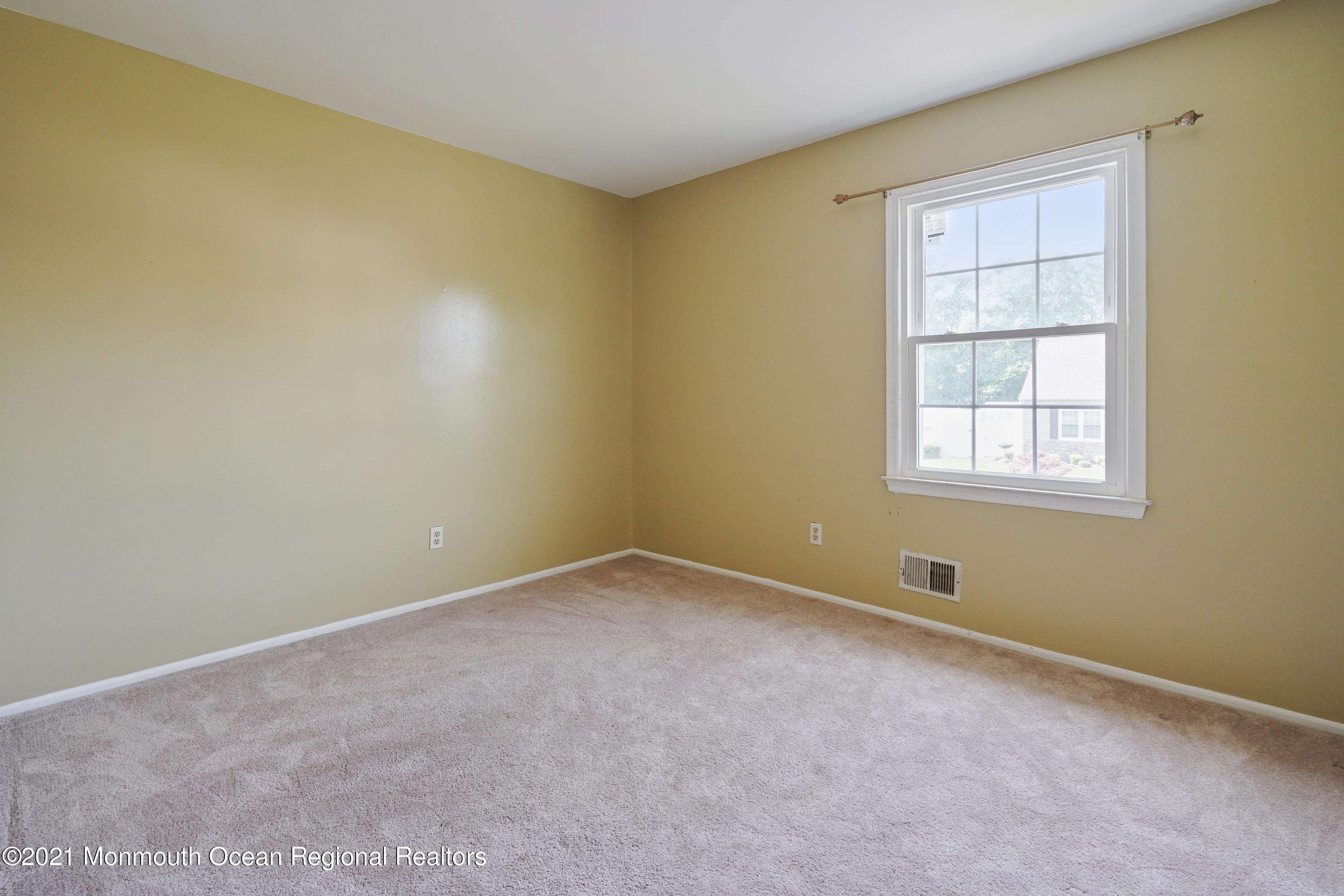 52 Danbury Road Tinton Falls, NJ 07753 - Photo 24 of 50 an empty room with a window