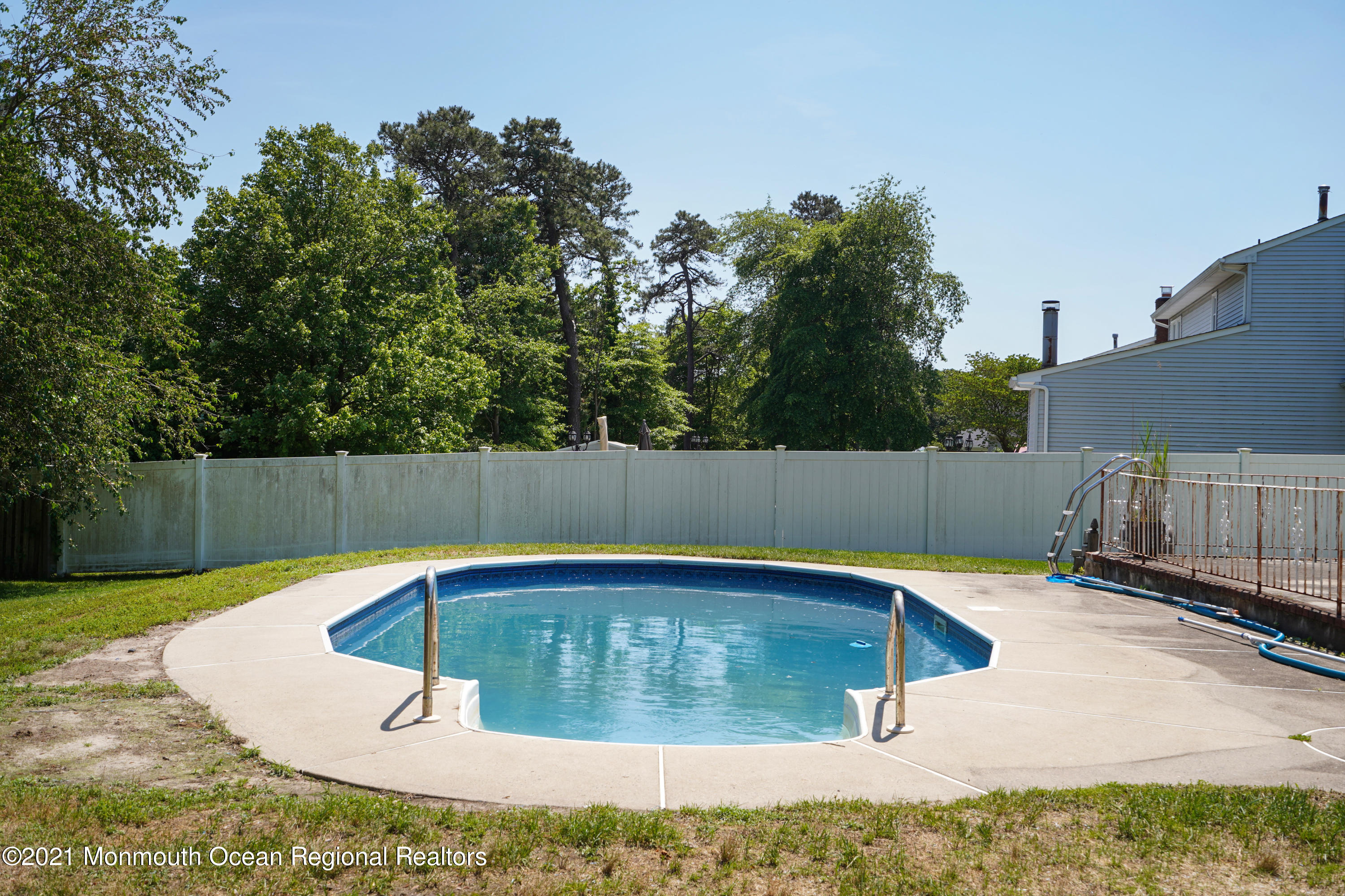 52 Danbury Road Tinton Falls, NJ 07753 - Photo 30 of 50 a view of a backyard with a slide