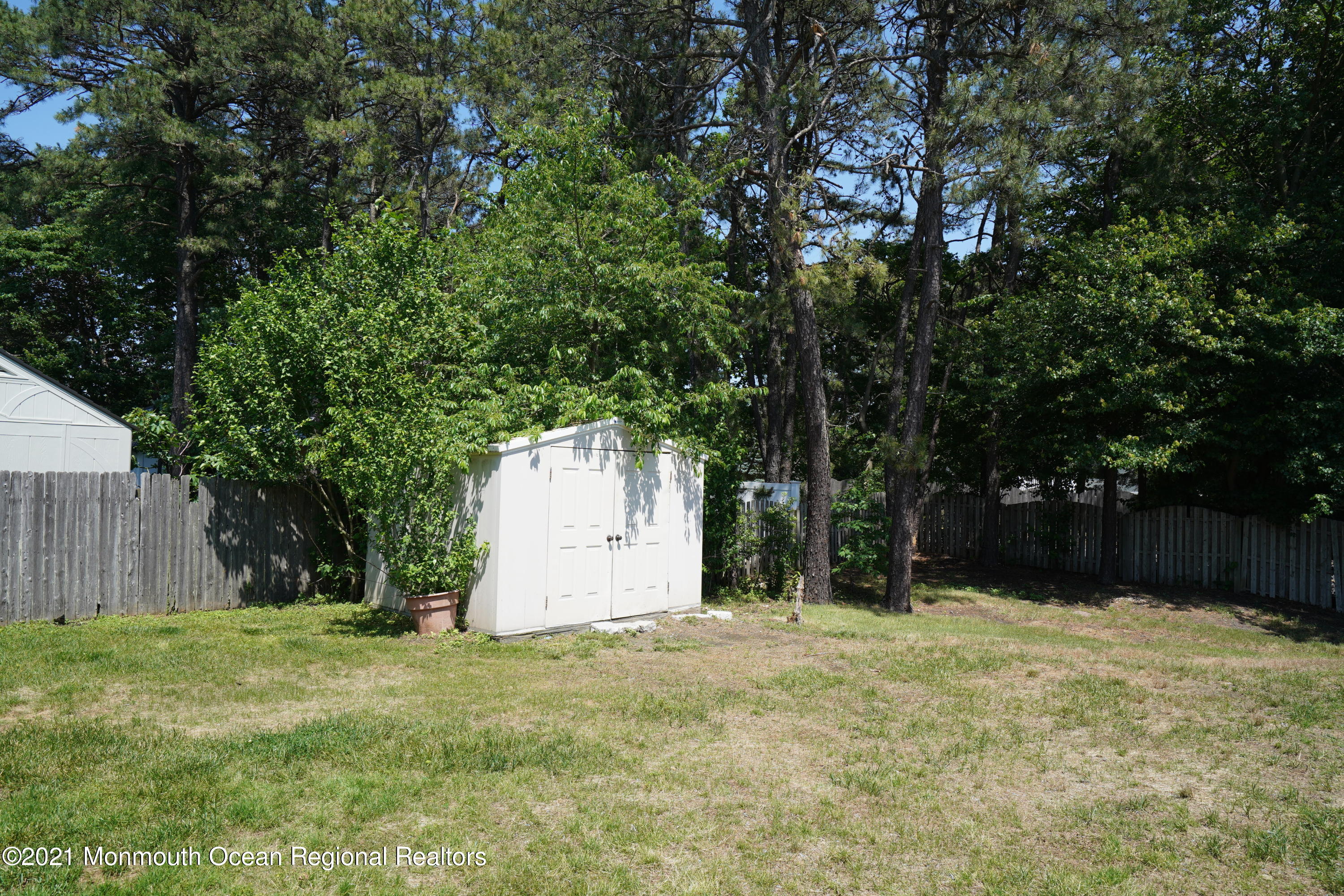 52 Danbury Road Tinton Falls, NJ 07753 - Photo 32 of 50 a house with trees in front of it