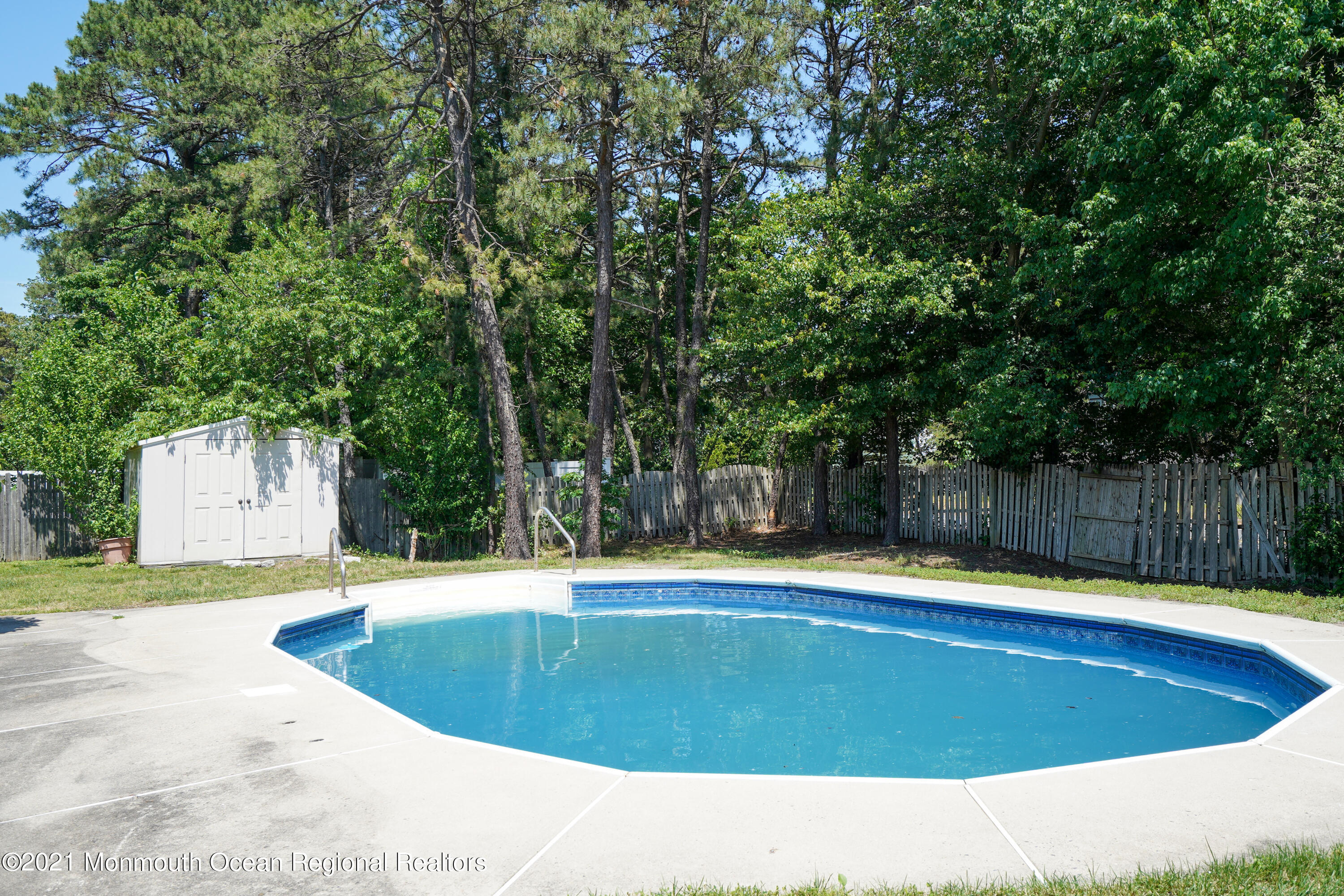 52 Danbury Road Tinton Falls, NJ 07753 - Photo 35 of 50 a view of a swimming pool with a yard