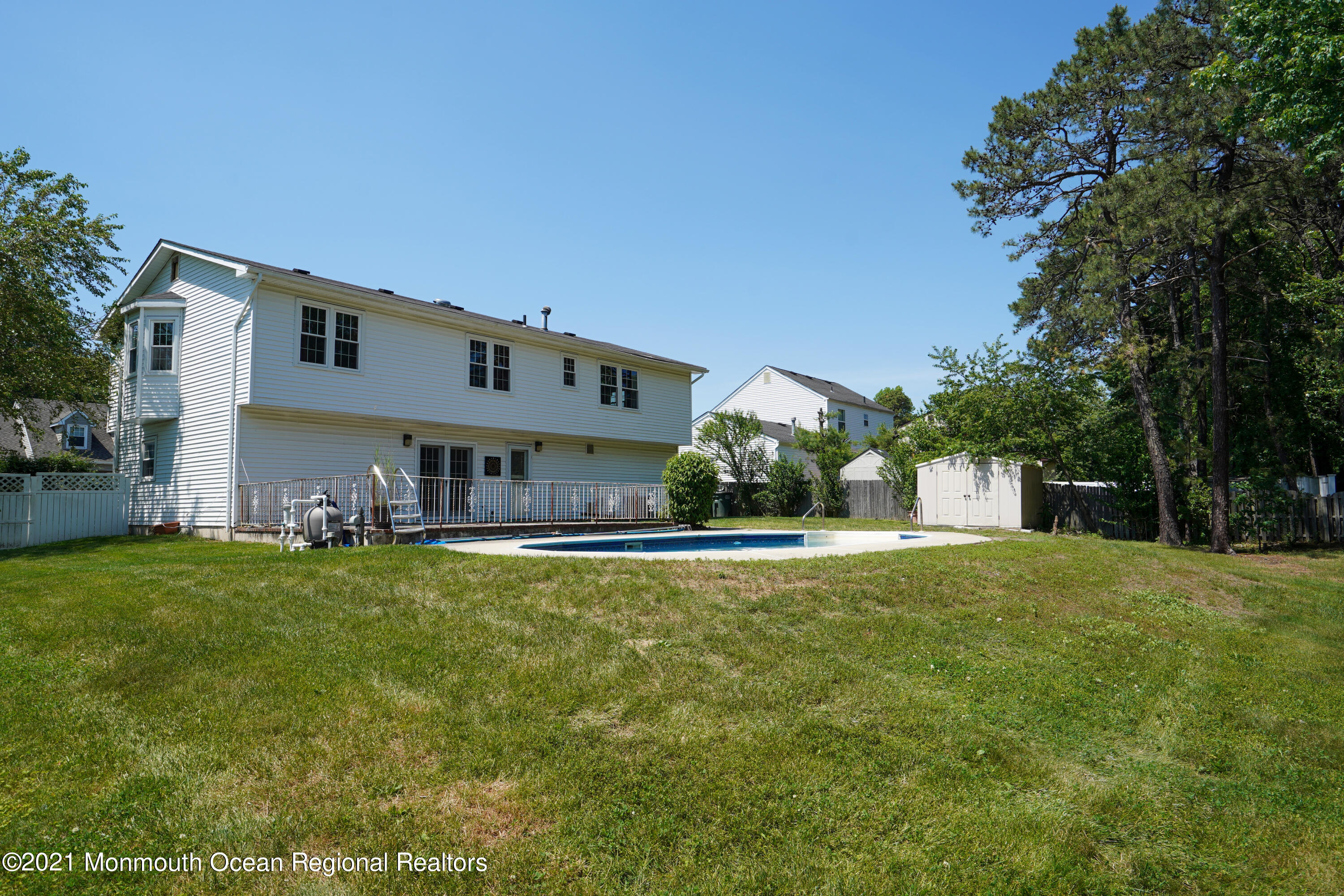 52 Danbury Road Tinton Falls, NJ 07753 - Photo 37 of 50 a front view of a house with a garden and yard