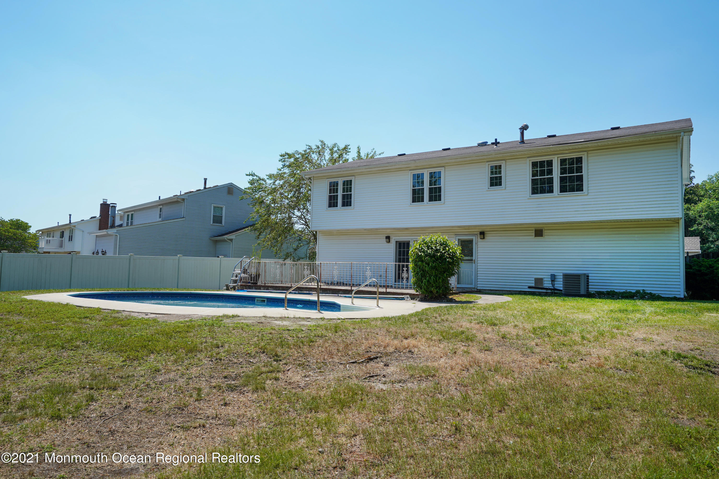 52 Danbury Road Tinton Falls, NJ 07753 - Photo 38 of 50 a view of a house with a patio and a yard