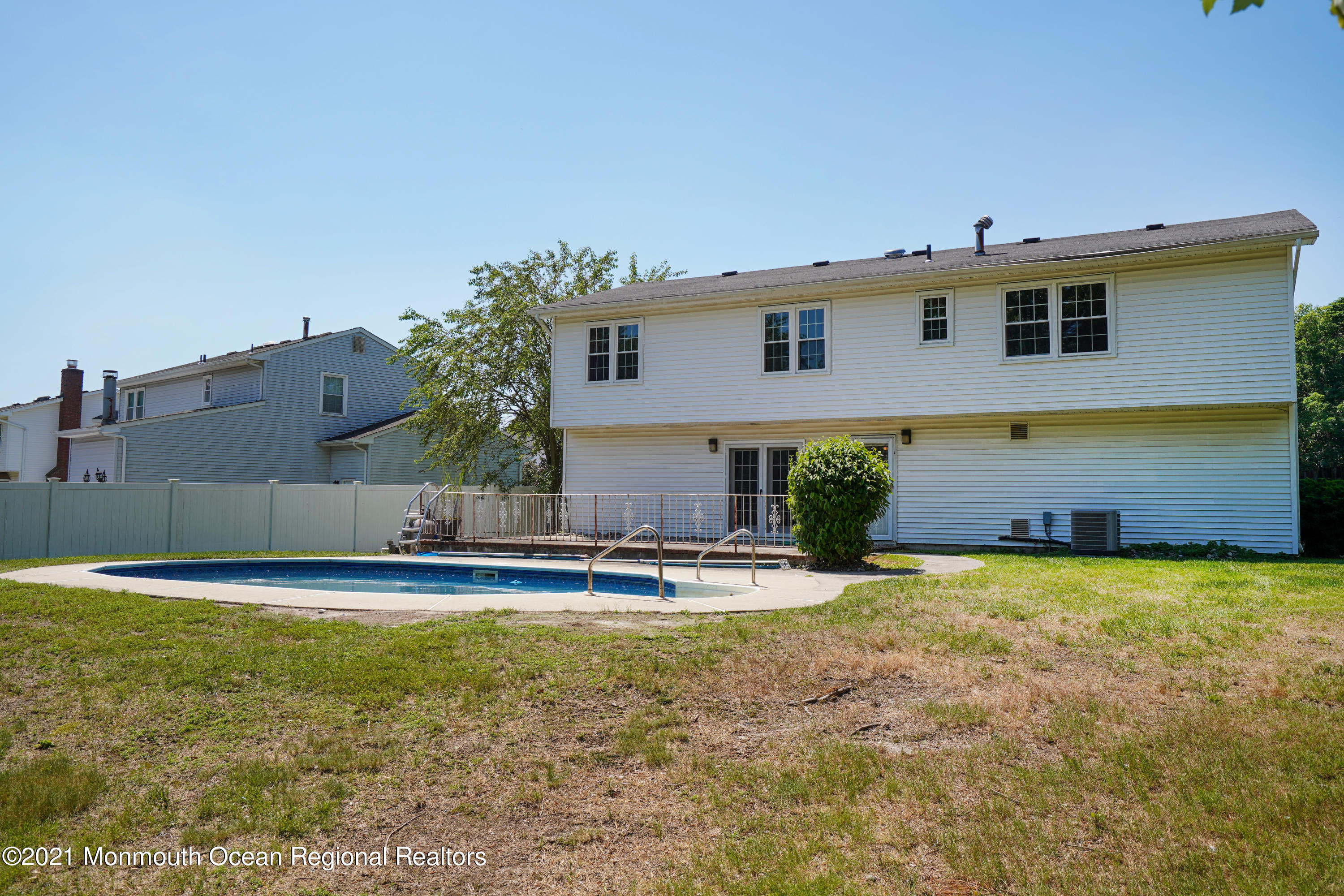 52 Danbury Road Tinton Falls, NJ 07753 - Photo 40 of 50 a view of a house with a swimming pool