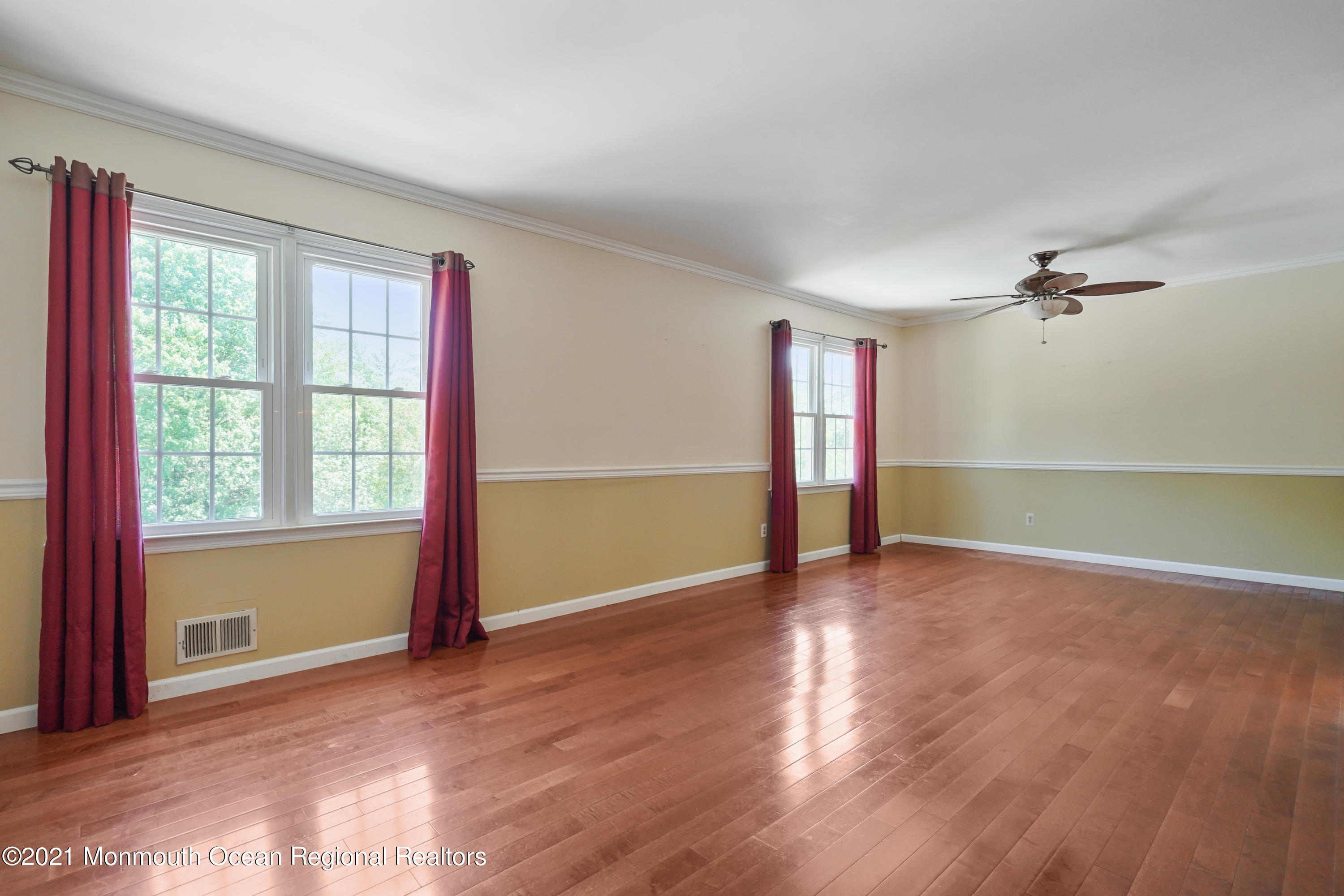 52 Danbury Road Tinton Falls, NJ 07753 - Photo 5 of 50 a view of an empty room with window and wooden floor