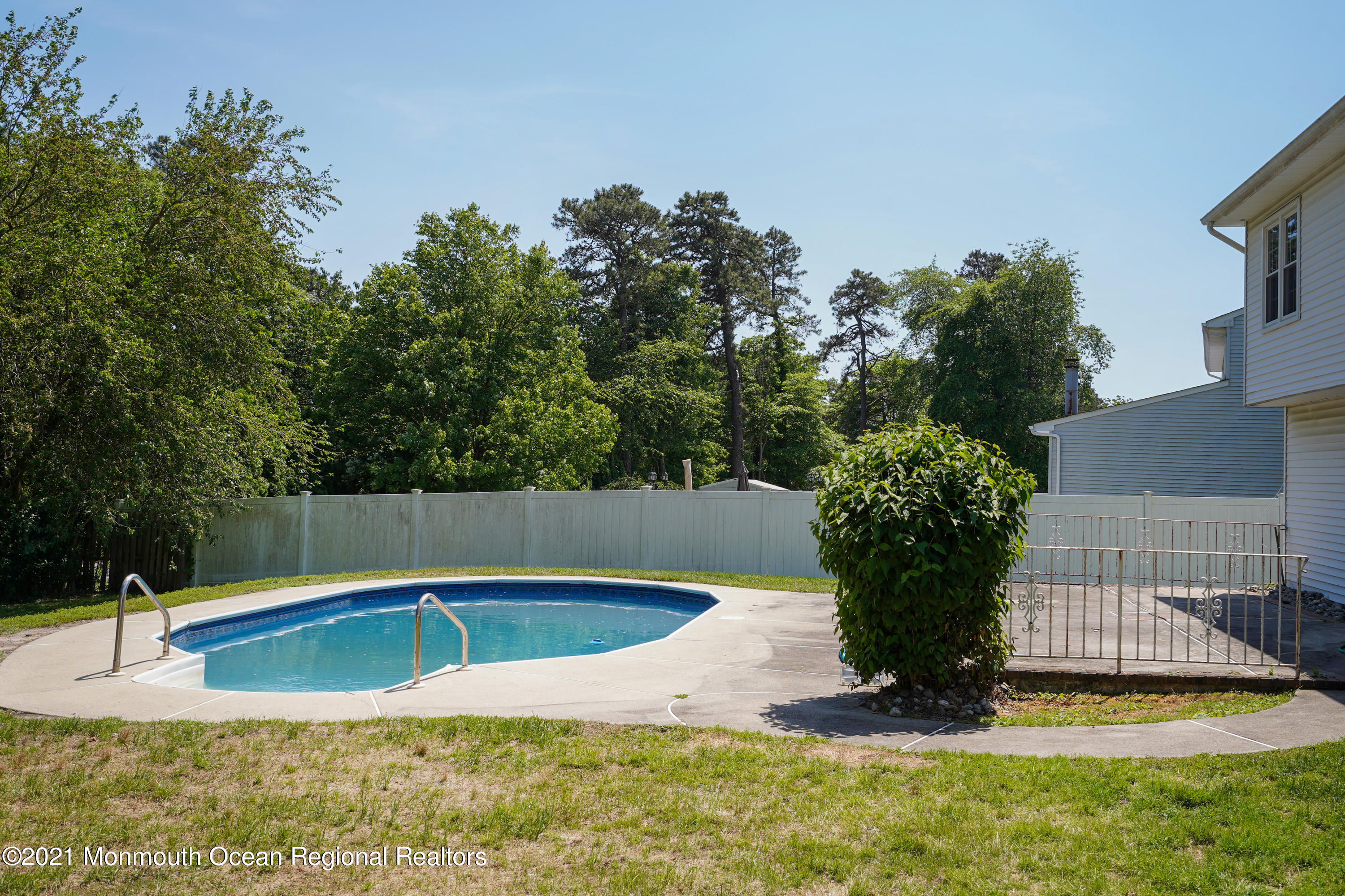 52 Danbury Road Tinton Falls, NJ 07753 - Photo 42 of 50 a view of a swimming pool with a yard